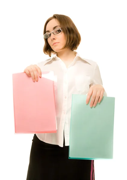 Picture of a girl in white offering green and red folders — Stock Photo, Image