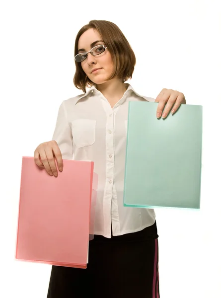 Picture of a girl in white demonstrating two folders — Stock Photo, Image