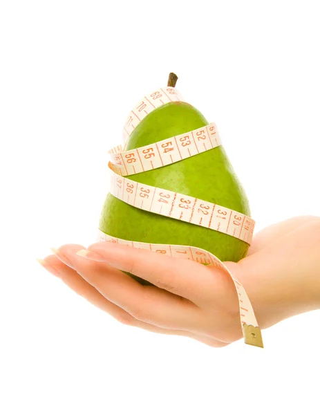 Green pear with measuring tape — Stock Photo, Image