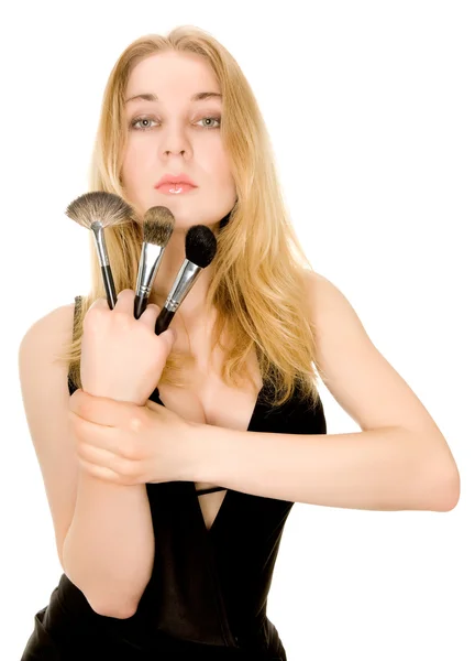 Beautiful blonde holding brushes — Stock Photo, Image