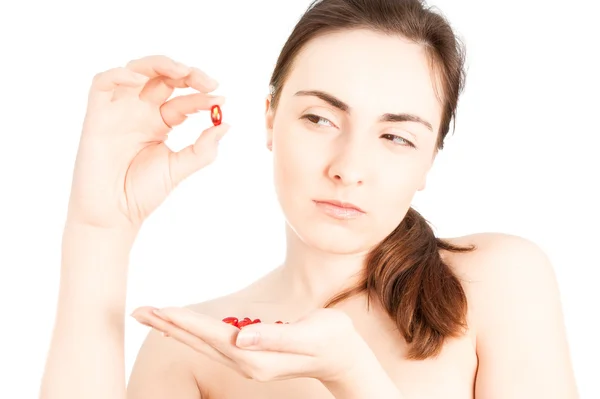 Beautiful woman looking doubtly on the cure — Stock Photo, Image