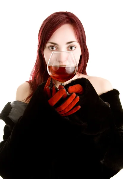 Beautiful girl with a glass of cognac — Stock Photo, Image