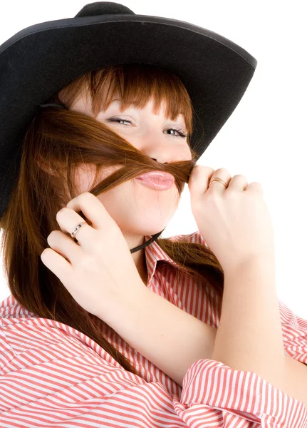 Röda haired cowgirl i hatt grimaserande — Stockfoto