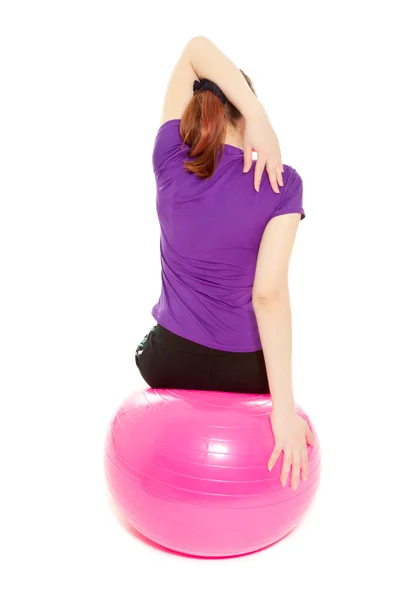 Woman with pink ball exercising — Stock Photo, Image