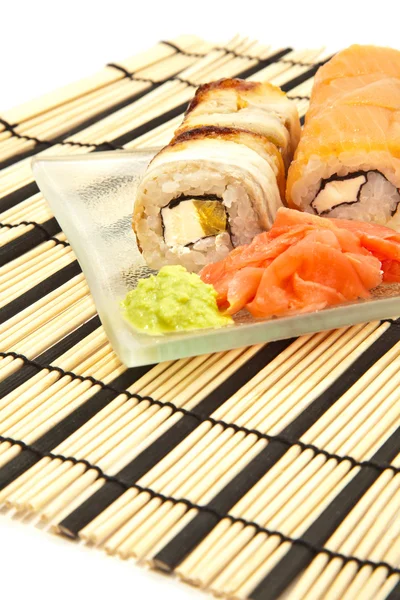 Maki sushi with wasabi on bamboo sushi mat — Stock Photo, Image
