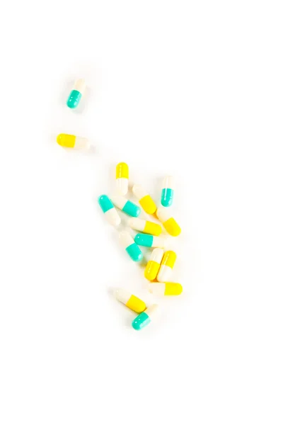 Foto van kleurrijke pillen geïsoleerd op wit — Stockfoto
