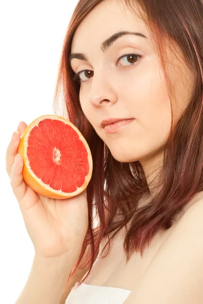 Vrouw met een stuk grapefruit — Stockfoto