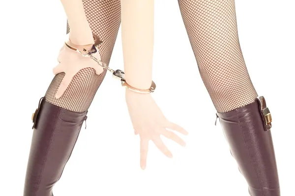 Woman's legs and hands with handcuffs — Stock Photo, Image