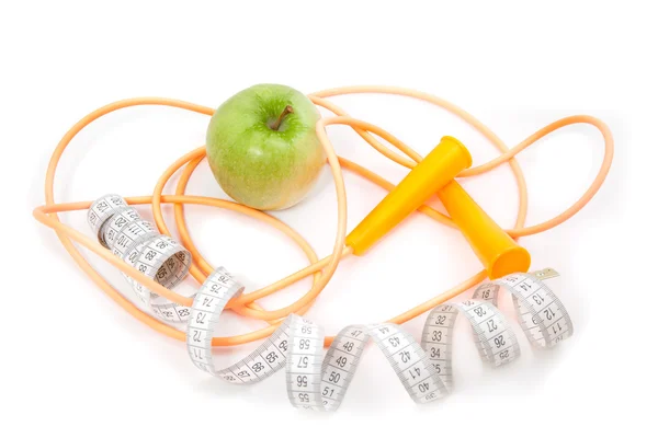 A green apple, tape measure and rope — Stock Photo, Image