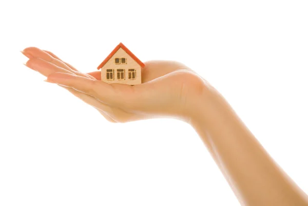 Woman hand with a little house — Stock Photo, Image