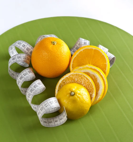 Picture of oranges and tape measure — Stock Photo, Image