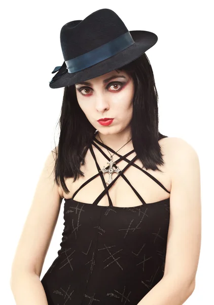 Young witch in halloween costume looking to the camera — Stock Photo, Image