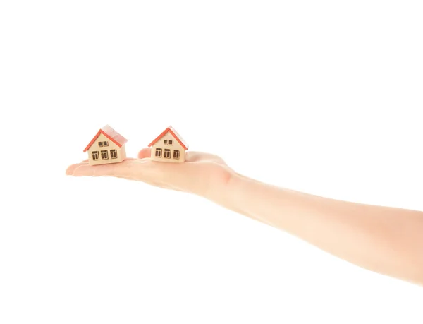 Woman hand with two little house — Stock Photo, Image