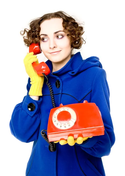 Девушка со старым красным телефоном — стоковое фото
