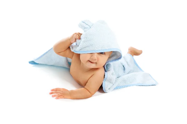 Beautiful baby under blue towel — Stock Photo, Image