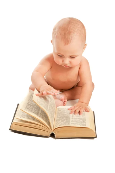 stock image Baby with big book sitting on the floor
