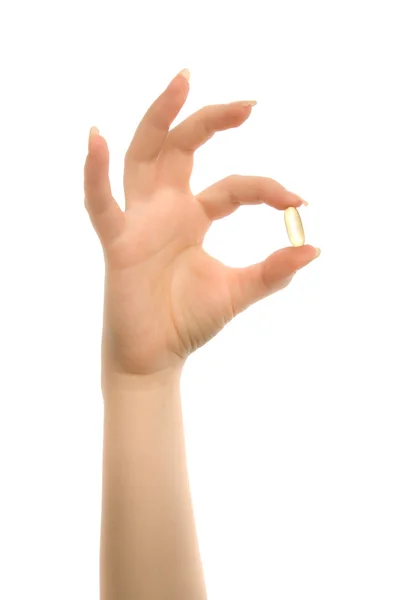 Mains de femme avec capsule — Photo