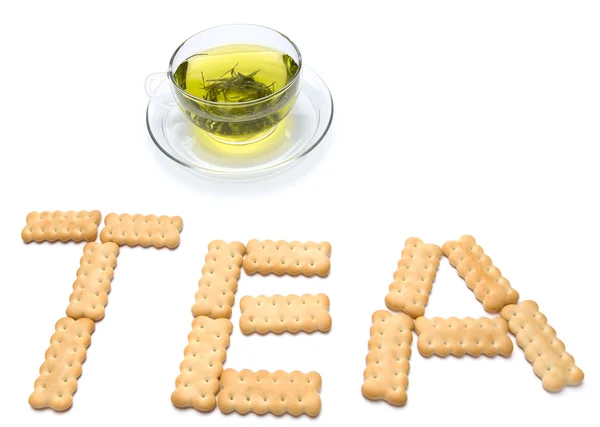 A cup of tea with cracker — Stock Photo, Image
