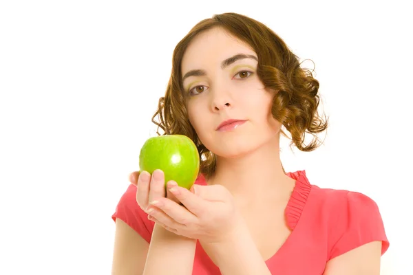 Piękna kobieta w różowej sukience z zielonym jabłkiem — Zdjęcie stockowe