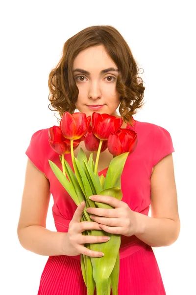 Schöne junge Frau mit Tulpen — Stockfoto