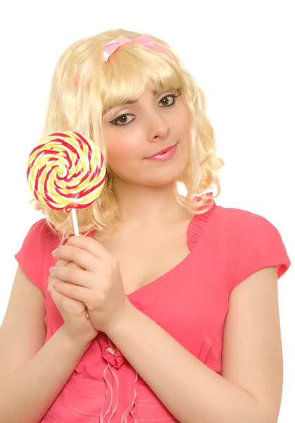 Mooie vrouw in blonde pruik met lolly — Stockfoto