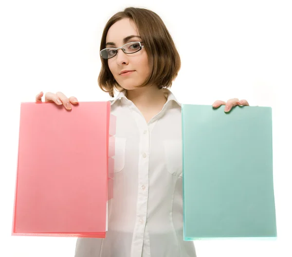 Picture of a girl in white holding two folders — Stock Photo, Image