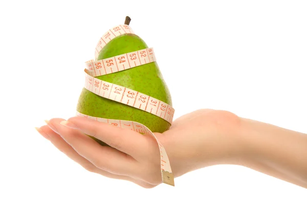 Green pear with measuring tape — Stock Photo, Image