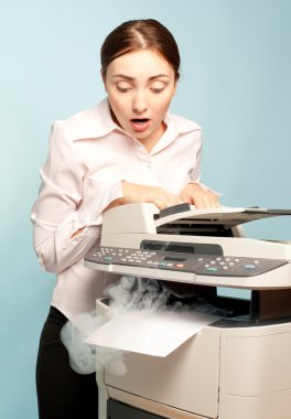 Surprised woman with smoking copier clipart