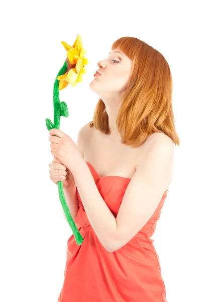 Beautiful woman kissed toy flower isolated on white — Stock Photo, Image