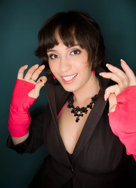 Picture of a young woman in jacket and pink gloves — Stock Photo, Image