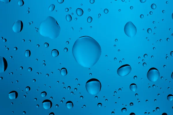 Muitas gotas de água no fundo — Fotografia de Stock