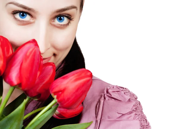 Woman with rad tulips bouquet — Stock Photo, Image