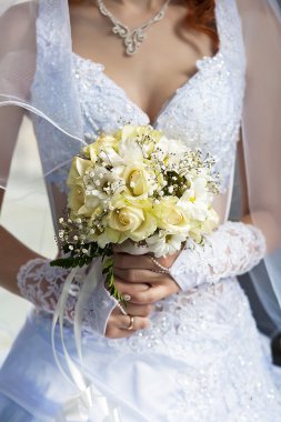 Bridal bouquet in the the bride's hands clipart