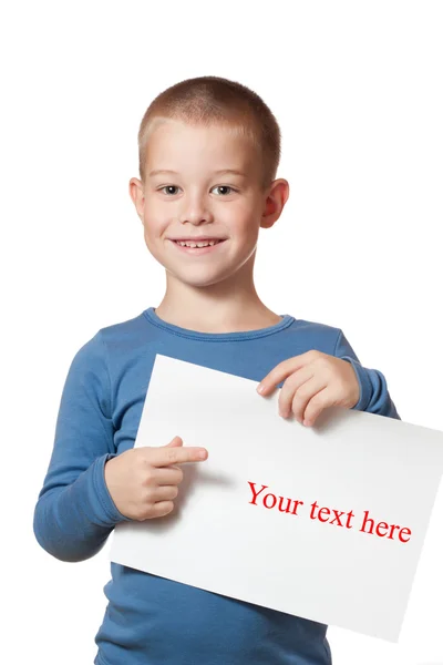 Smiling boy holding paper blank — Stock Photo, Image