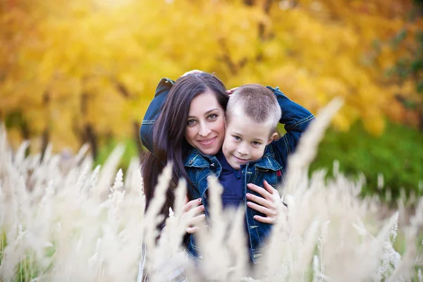 Mother and son on the meadow — Stock Photo, Image