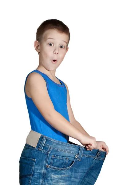 Kid in te groot jeans — Stockfoto