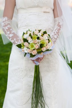 Bridal bouquet in the the bride's hands clipart