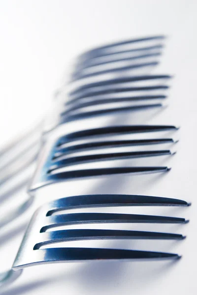 Several forks on a white background — Stock Photo, Image