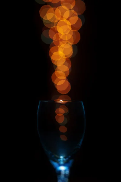 Empty glass isolated on a bokeh background — Stock Photo, Image