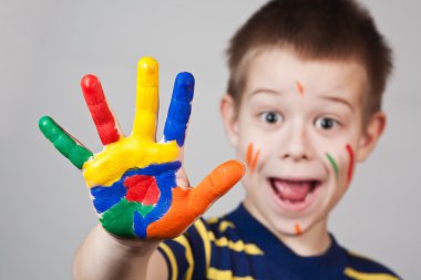 Child showing his colored hands clipart