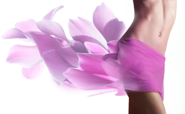 Beautiful woman with petals on her hips — Stock Photo, Image