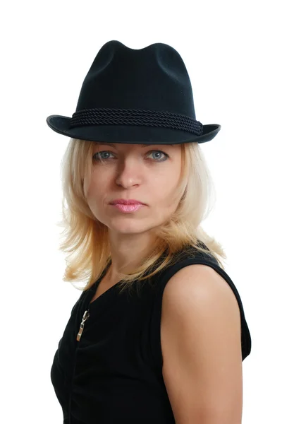 Serious woman with a black hat — Stock Photo, Image