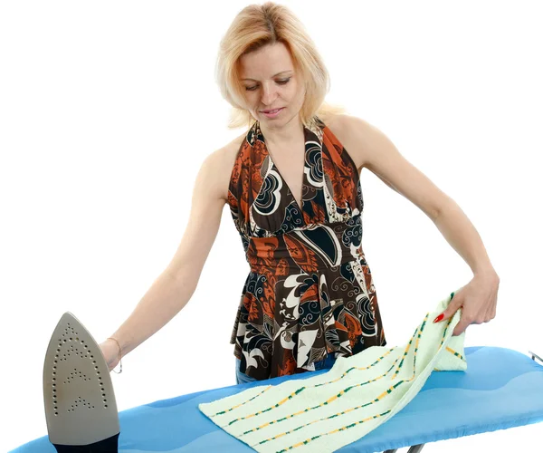 Beautiful housewife ironing the laundry — Stock Photo, Image