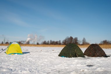 Winter fishermen tents clipart