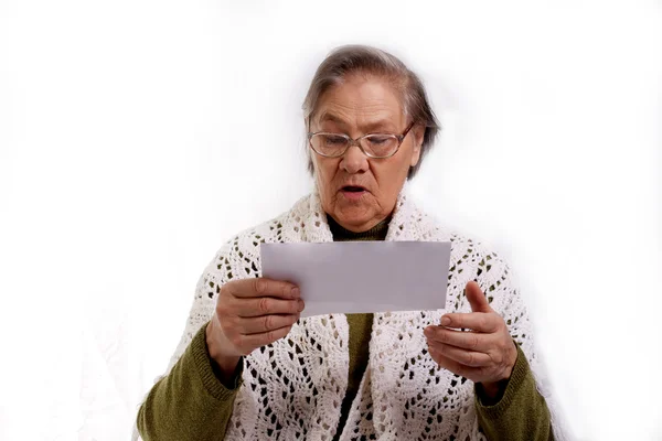 Senior woman with bills — Stock Photo, Image
