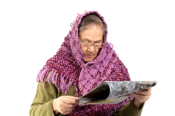 Senior woman reading magazine — Stock Photo, Image