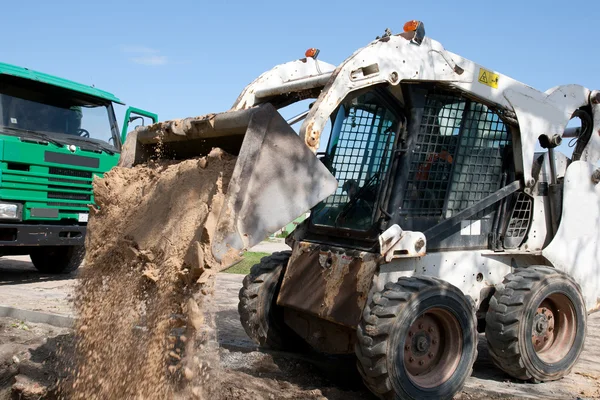 Mini excavator at construction site — Stock Photo, Image
