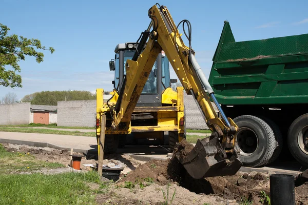Excavator loaded dumper truck — Stock Photo, Image