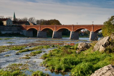 Old brick bridge over river Venta clipart