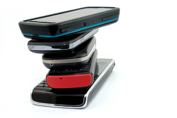 Pila di diversi telefoni cellulari — Foto Stock